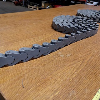 Muovinen kuljetin ketjua